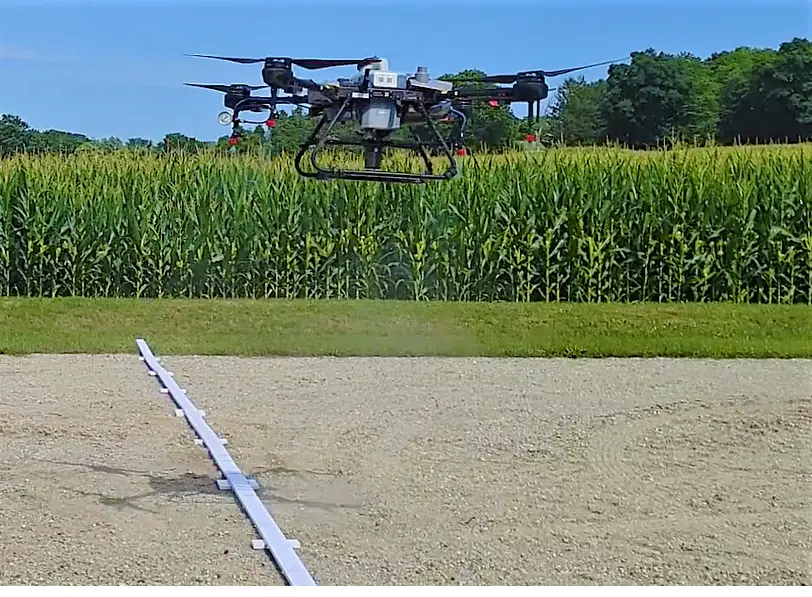 Swath Gobbler T30 Flying over boards.webp